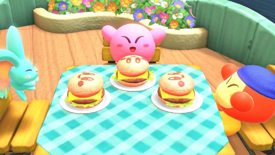 Kirby i jego dwaj przyjaciele jedzą hamburgery